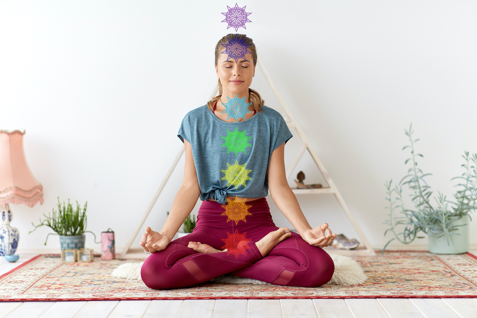 mindfulness, spirituality and healthy lifestyle concept - woman meditating in lotus pose at yoga stu